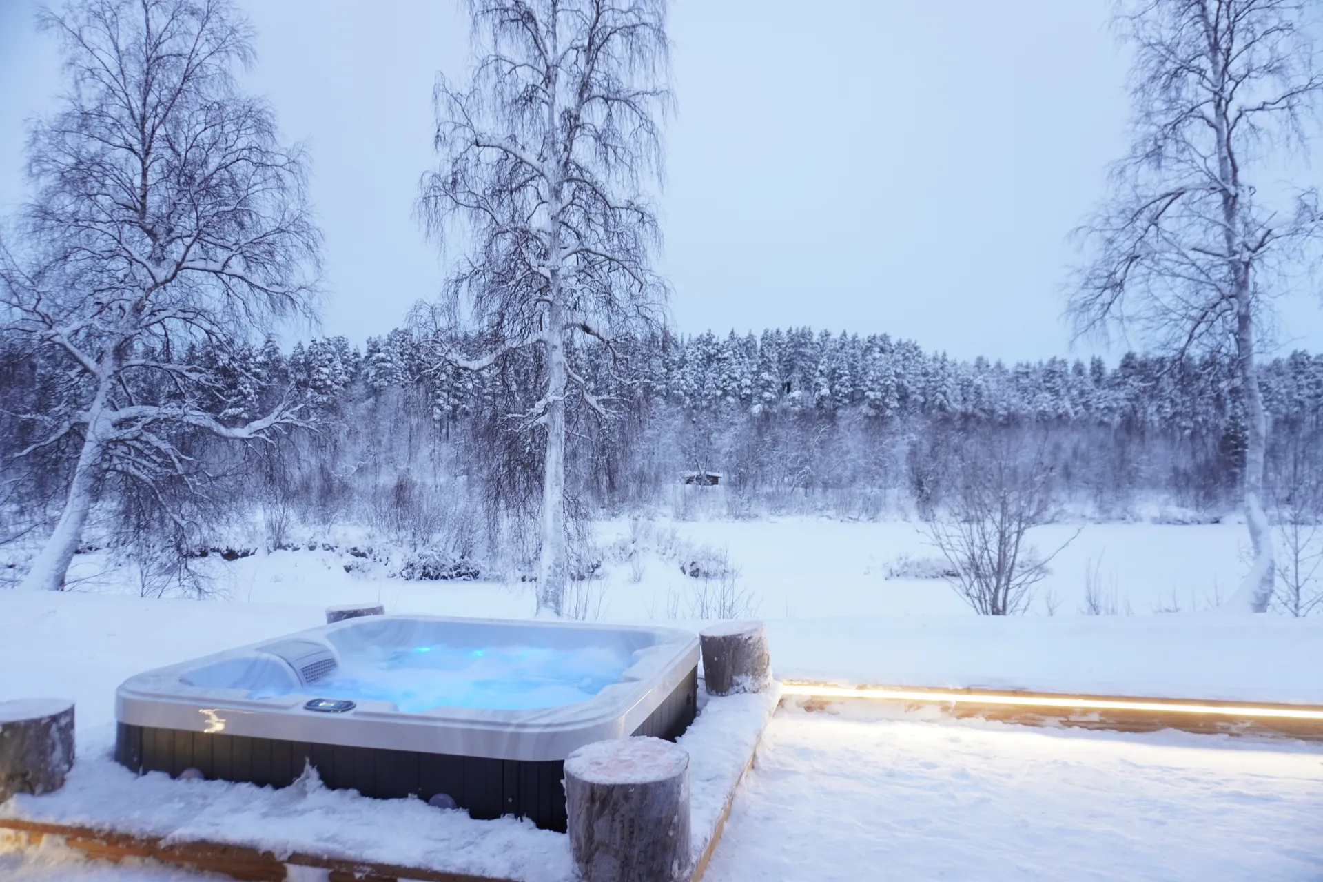 Jacuzzi surrounded by snow